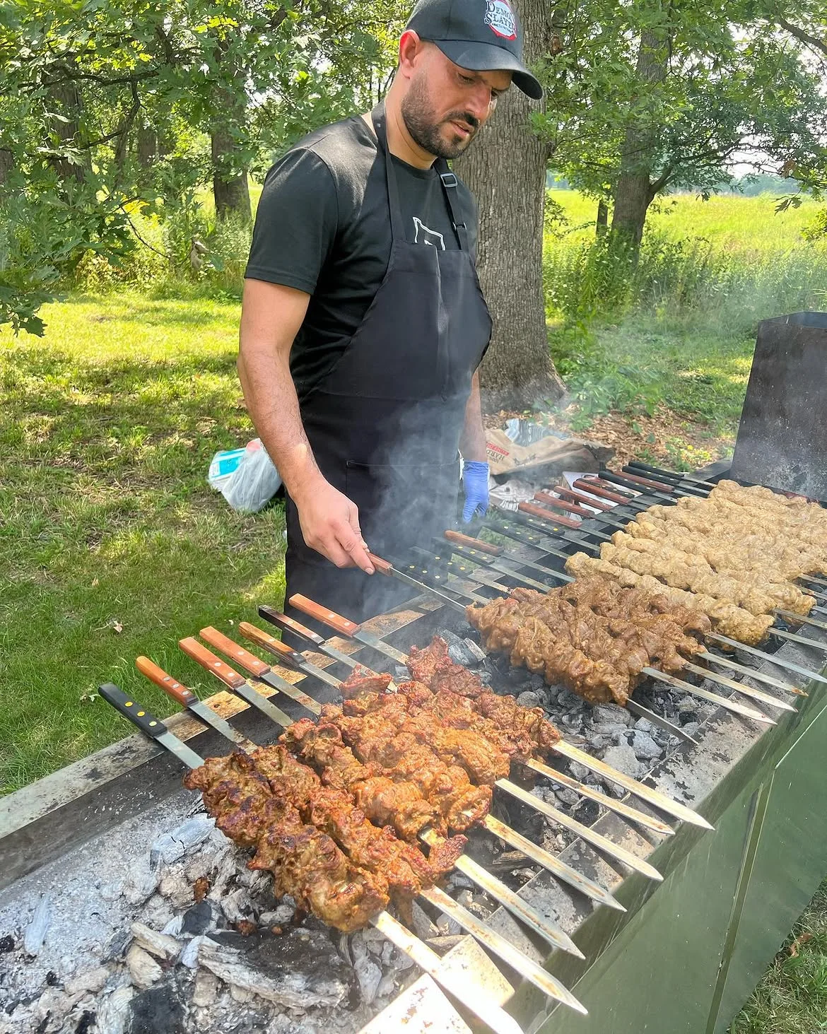 Skewers grilling at a Signature Barbecue event